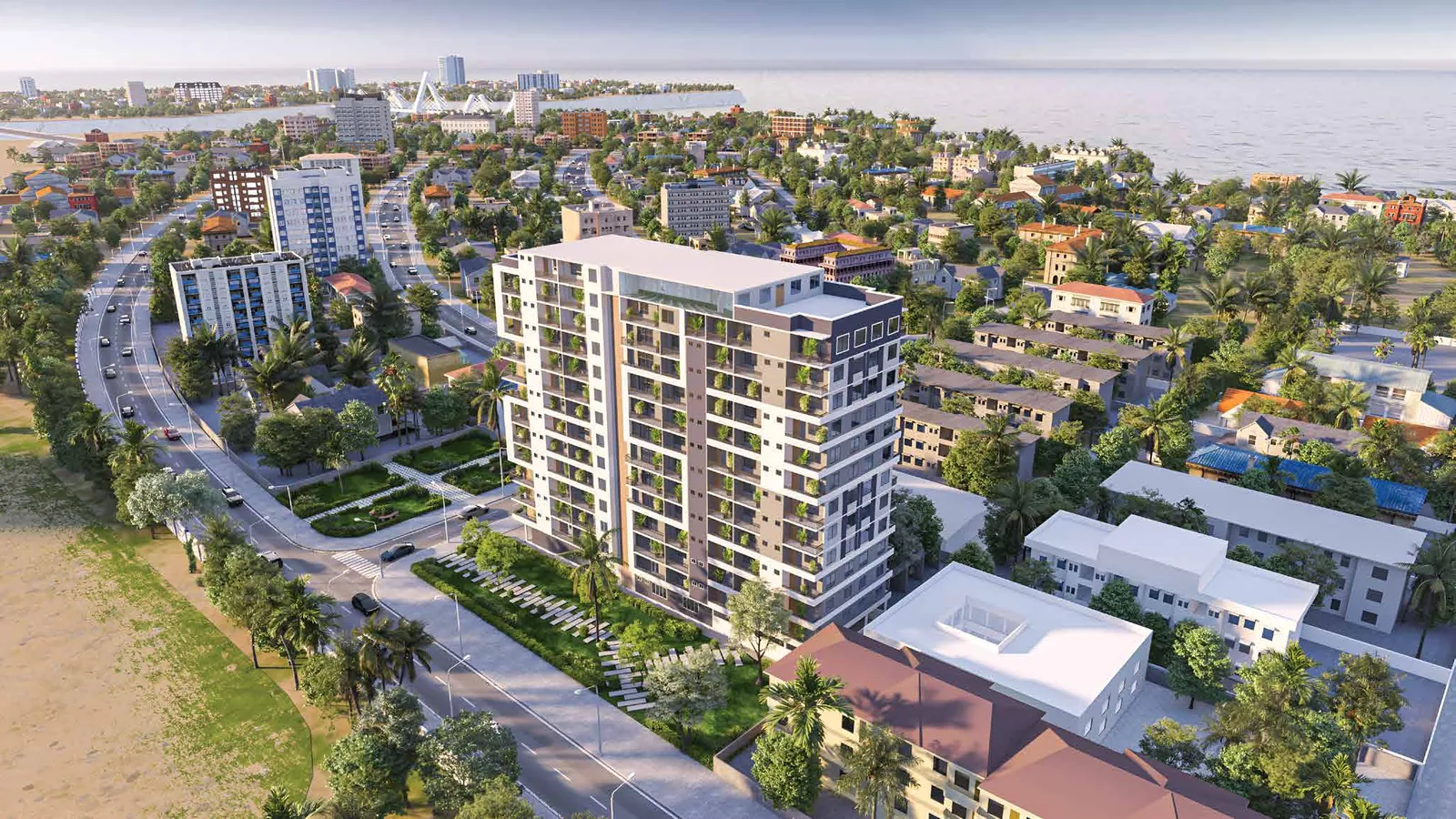 Aerial view of Delta Residency among Upanga's trees, with the ocean and the Tanzanite Bridge behind